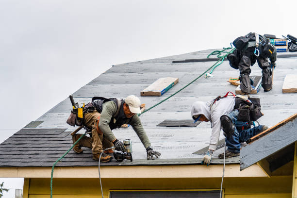 Professional Emergency Roof Repair technician working in Spring Glen, NY